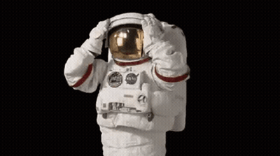 Man In Space Suit Saluting With Hands On Helmet GIF