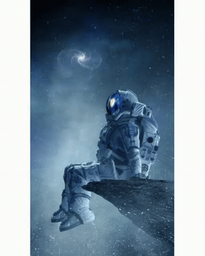 Man In Space Suit Sitting In Chair GIF