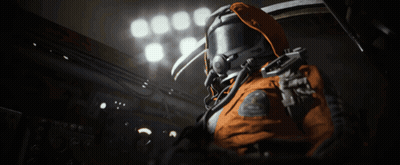 Man In Space Suit Standing In Dark Room With Lights GIF