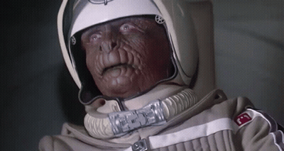 Man In Space Suit With A.M. Badge GIF
