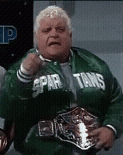 Man In Spartans Jacket Holding Wrestling Belt GIF