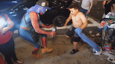 Man In Spider-Man Costume Standing Next To Boy GIF