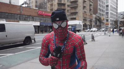 Man In Spiderman Costume Holding Microphone GIF