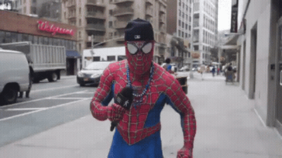 Man In Spiderman Costume Holding Microphone GIF