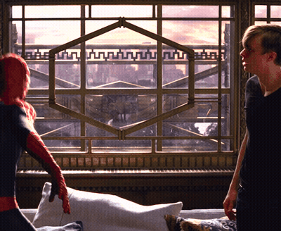 Man In Spiderman Costume In Front Of Large Window GIF
