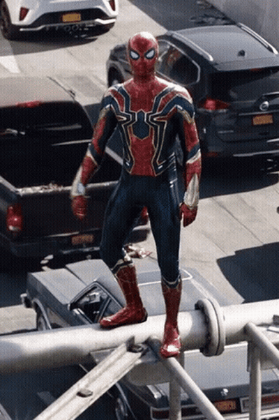 Man In Spiderman Costume On Pole GIF