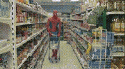 Man In Spiderman Costume Pushing Shopping Cart GIF