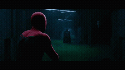 Man In Spiderman Costume Standing In Front Of Lockers GIF