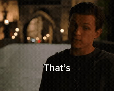 Man In Spiderman Costume Standing In Front Of Lockers GIF