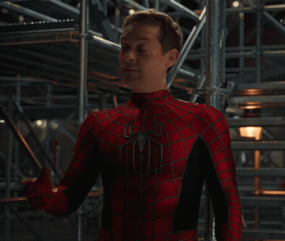 Man In Spiderman Costume Standing In Front Of Staircase GIF