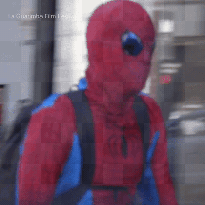 Man In Spiderman Costume Walking Down Street GIF