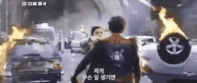 Man In Spiderman Shirt Walking Down Street GIF