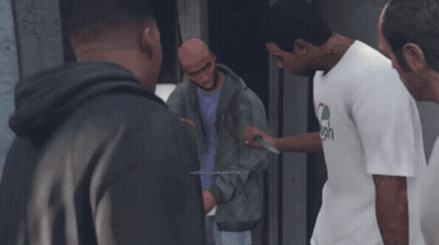Man In Spoon Shirt Talks To Group Of Men GIF