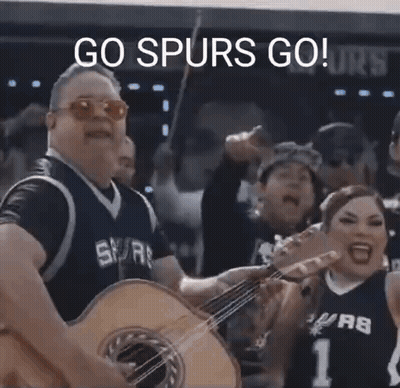 Man In Spurs Jersey Playing Guitar GIF