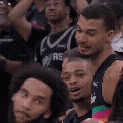 Man In Spurs Jersey Sitting In Crowd GIF