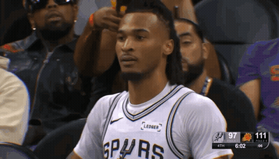 Man In Spurs Jersey Sitting In Stands GIF