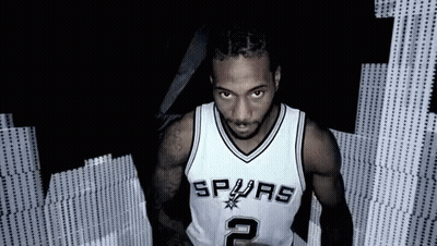 Man In Spurs Jersey Standing In Dark GIF