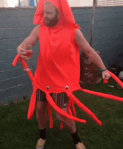 Man In Squid Costume Holding Wine Glass GIF