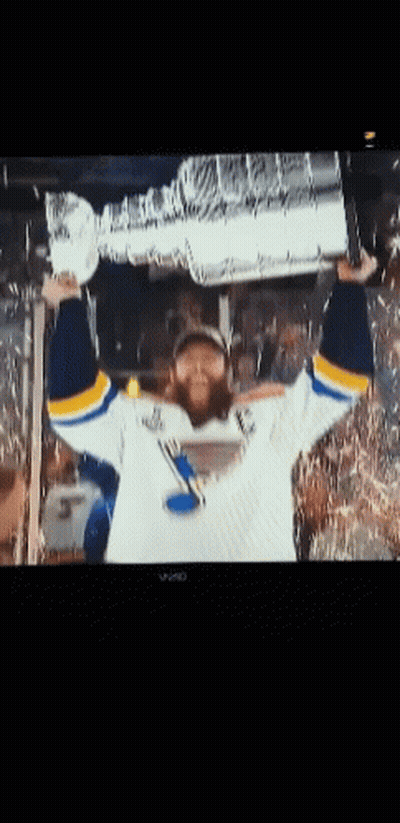 Man In St. Louis Blues Jersey Holding Trophy GIF