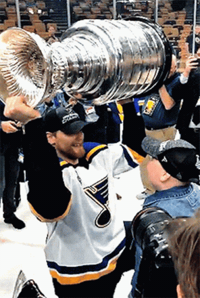 Man In St. Louis Blues Jersey Holding Trophy GIF
