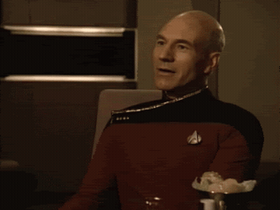 Man In Star Trek Uniform Clapping And Smiling GIF