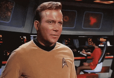Man In Star Trek Uniform Looking At Camera GIF