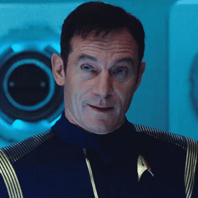 Man In Star Trek Uniform Looking At Camera GIF