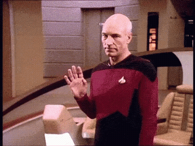 Man In Star Trek Uniform Waving GIF
