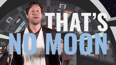 Man In Star Wars Costume In Front Of Sign Saying That's No Moon GIF