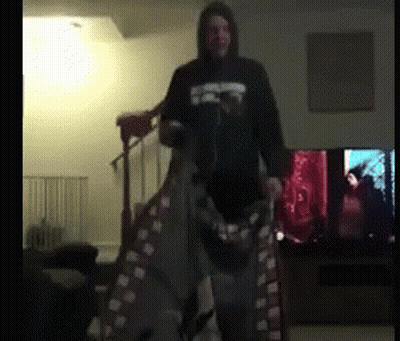 Man In Star Wars Costume Standing In Living Room GIF