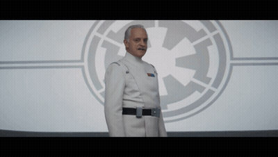 Man In Star Wars Uniform In Front Of Logo GIF