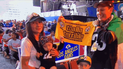 Man In Steelers Jacket Holding Helmet GIF
