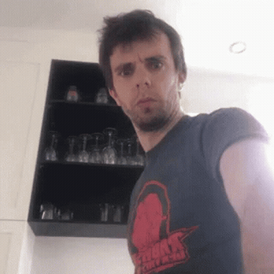 Man In Storm Chasers T-Shirt By Wine Glasses GIF
