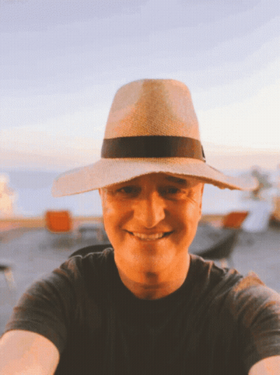 Man In Straw Hat And Black Shirt Smiling GIF