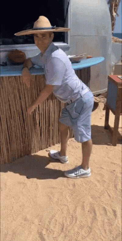 Man In Straw Hat And Shorts On Beach GIF