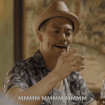 Man In Straw Hat Drinking Glass Saying Mmm GIF