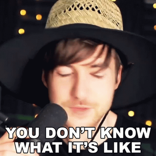 Man In Straw Hat Holding Microphone GIF