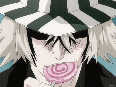 Man In Striped Hat Eating Lollipop GIF