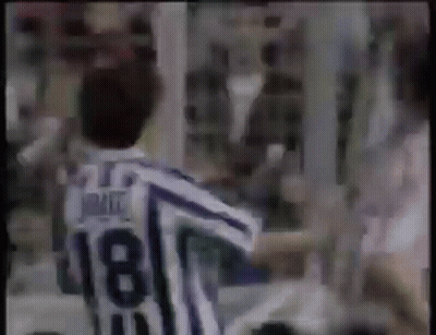 Man In Striped Jersey Number 18 In Front Of Crowd GIF