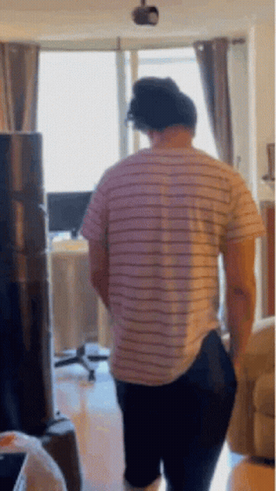 Man In Striped Shirt And Black Pants GIF
