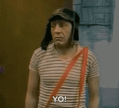 Man In Striped Shirt And Hat In Front Of Door GIF