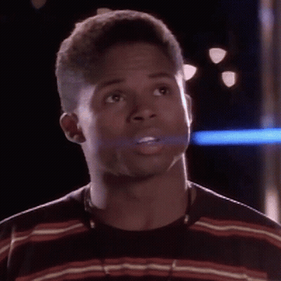 Man In Striped Shirt And Necklace Surprised GIF