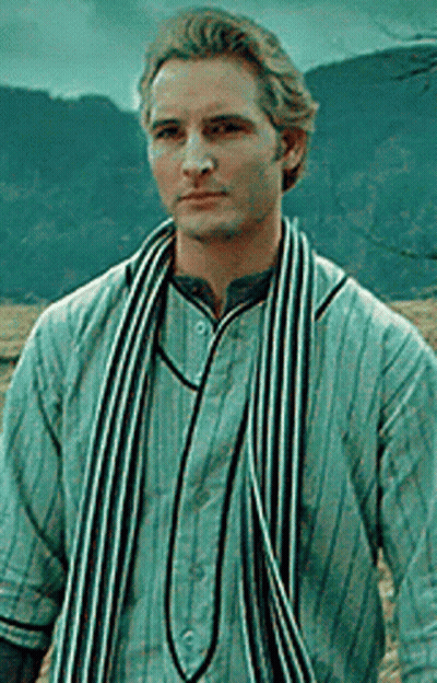 Man In Striped Shirt And Scarf Standing In Front Of Mountain GIF