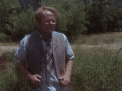Man In Striped Shirt And Tie Running In Field GIF