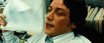 Man In Striped Shirt And Tie Sweating Holding Paper GIF