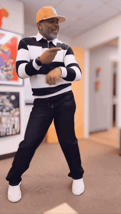 Man In Striped Shirt And Yellow Hat Dancing GIF