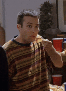 Man In Striped Shirt Eating Sandwich GIF