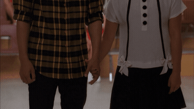 Man In Striped Shirt Examined By Red Jacket GIF