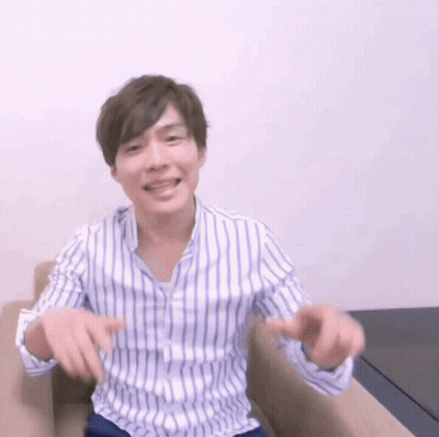 Man In Striped Shirt Hands Outstretched GIF
