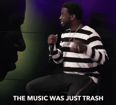 Man In Striped Shirt Holding Microphone GIF